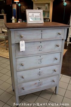 a blue dresser with numbers on it in a store