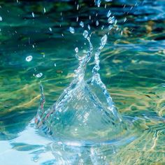 water splashing on the surface of a body of water