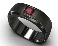 "Classy, clean, elegant yet unique. Nobody said a minimalist look should entail basic colors and forgettable designs, we managed to preserve the refined style while also making it one-of-a-kind by taking an amazing vivid red ruby and setting it flush in a rounded-square ring of black gold with varying texture, sheer and sleek on the interior and sides, and a brushed gold texture on the face of the band to contrast beautifully with the polish of the gemstone. PAYMENT PLAN- Click Here To Find The Modern Ruby Wedding Ring, Modern Red Ruby Ring For Wedding, Modern Red Ruby Wedding Ring, Modern Red Wedding Rings, Minimalist Red Rings For Formal Occasions, Modern Red Jewelry For Wedding, Ruby Mens Wedding Band, Mens Sapphire Wedding Band, Mens Wedding Band Black