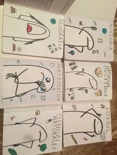 four children's notebooks with drawings on them