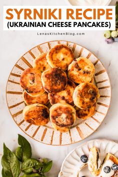 some blueberry cheese pancakes on a plate with spinach leaves and flowers in the background