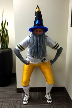 a man dressed in yellow pants and a wizard hat