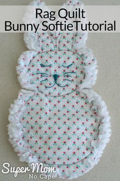 the rag quilt bunny softie sewing pattern is shown in white with red, blue and green stars