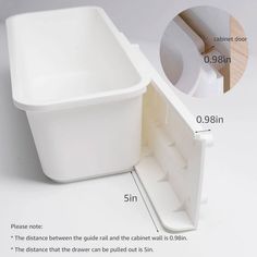 an image of a white plastic container with measurements for the bottom and side opening to it