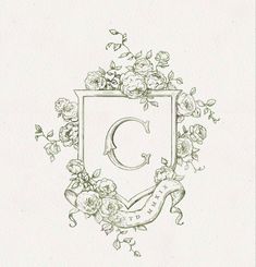 the letter c is surrounded by flowers and vines