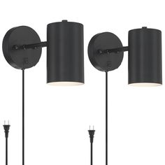 three black lamps with one light on each side and the other off to the side