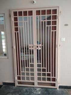 an iron gate in the corner of a room