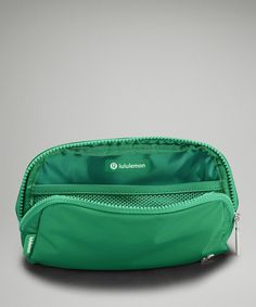 an image of a green cosmetic bag on a gray background with the name lubulmon printed on it