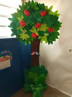 a paper apple tree next to a calendar