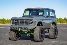 an off - road vehicle is parked in a parking lot