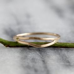 This delicate yet striking ring is made from one piece of hammered metal which wraps one and a half times around your finger, giving the appearance of two wavey stacking rings, yet maintaining the negative space between each band. The ring is wrapped and then soldered closed so it maintains both its shape and size. It has a lovely subtle hammered texture which adds dimension and sparkle. Available in sterling silver and 14k gold fill, as well as solid 14k gold in yellow and rose. sizes 5-9. All Stackable 14k Gold Bypass Ring With Open Band, 14k Gold Stackable Bypass Ring With Open Band, Hammered 14k Gold Open Stackable Rings, 14k Gold Hand Forged Open Band Ring, Stackable Open Band Rings In Recycled Gold, 14k Gold Hammered Bands, Minimalist 14k Gold Wavy Ring, Minimalist Yellow Gold Wavy Ring, Minimalist Wavy Yellow Gold Ring