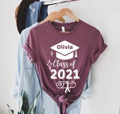 "Achiever Graduation T-Shirt, Graduation Personalized Shirt, Family Graduation Shirt, Class Of 2021 Shirt, Senior Custom Shirt, Senior Grad Welcome to my store :) I am so glad to see you here. I make my t-shirts with love. I am sure you will like them. Please make sure you check the size chart before ordering. Unisex size is fit for men but a little loose for women. If you want to have a fitter look, you can select one size smaller. The inscriptions on the T-shirts are black in light colors and Cotton Crew Neck Top For Graduation, Relaxed Fit Crew Neck Top For Graduation, Custom Print Cotton Tops For Graduation, Cotton Letter Print Top For Graduation, Graphic Tee Crew Neck For Graduation, Short Sleeve Shirt With Text Print For Graduation, Custom Print Crew Neck Shirt For Graduation, Memory Shirt, Graduation Shirts For Family