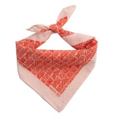 an orange bandana with white and red designs on the front, tied in a knot