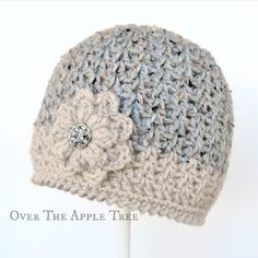 a crocheted hat with a flower on top