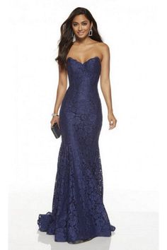 Get ready to turn heads at prom with the Navy 60653 Strapless Fitted Lace Dress by Alyce Paris. This stunning lace prom dress offers a perfect blend of elegance and style. Shop now for the ultimate prom look with Alyce Paris dresses found at cargoclothing.  Exquisite navy lace fabric for a timeless and sophisticated look Strapless design for a flattering and alluring sweetheart neckline Fitted silhouette to accentuate your figure Perfect choice for prom or other special occasions navy fitted red Midnight Prom Dress, Navy Lace Prom Dress, Alyce Paris Prom Dresses, Lace Long Gown, Fitted Lace Dress, Elegante Y Chic, Alyce Paris, Affordable Prom Dresses, Prom Dress Stores