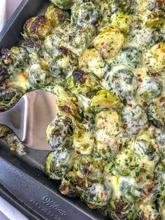 a casserole dish with brussel sprouts and other toppings