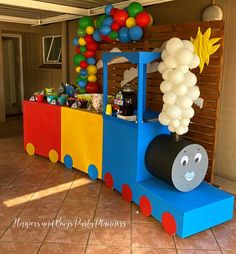 a train themed birthday party with balloons and decorations