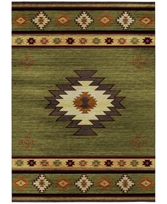 a green rug with brown, beige and tan designs on the bottom half of it