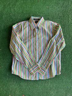 "Vintage colorful striped Ralph Lauren button-up. Women Size Petite Small. 100% Cotton. In fabulous vintage condition. Measurements laying flat Armpit to armpit 18\" (36\" total) From the top of the shoulder to the bottom of the sleeve cuff 26\" Total length of shirt 22\" Items are shipped out within 1-2 business days. If you have any questions please feel free to message me I reply quickly. Check out the rest of my shop www.etsy.com/shop/alwaysvintagenvogue Thank you for looking and happy shopp Retro Striped Shirt, Classic Multicolor Shirt For Spring, Multicolor Button-up Top With Striped Collar, 90s Ralph Lauren, 90s Shirts, Long Tee, Palm Desert, Retro Stripes, Sleeve Cuff