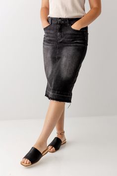 Denim skirts are always in season and the 'Esme' in Vintage Black is no exception! This modest denim skirt features a five pocket cut, distressed detailing and a raw hem. Wear with a casual graphic tee or a flowy blouse. Available in two lengths for you to choose from! Exclusively designed by us for you! 95% Cotton 5% Spandex Machine Wash Cold Do Not Bleach Hang to Dry Iron Low Heat Do Not Dry Clean Model Height 5'5" Wearing Size 4 in 26" Length Please carefully measure a similar item before pla Casual Black High Rise Denim Skirt, Casual Black Cotton Denim Skirt, Spring Washed Black Denim Skirt, Affordable Cotton Black Denim Skirt, Modest Denim Skirts, Mid-rise Black Cotton Denim Skirt, Cute Church Outfits, Classic Black Dress, Black Denim Skirt