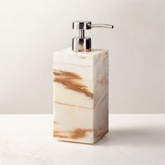 Rectangular soap pump is crafted of Calacatta gold marble with rich natural veining and a smooth finish. Pair with the full Ramsey Calacatta gold marble bath collection for a coordinated look. CB2 exclusive.     Solid Calacatta gold marble  Stainless steel pump  Variation in veining and activity of marble is to be expected; each will be unique  Wipe with a soft cloth  Imported Ramsey Calacatta Gold Marble Soap Pump White Bathroom Storage, Marble Soap, White Bath Mat, Calacatta Gold Marble, Apartment Stuff, Marble Bath, Bath Collection, Bathroom Soap Dispenser, Calacatta Gold