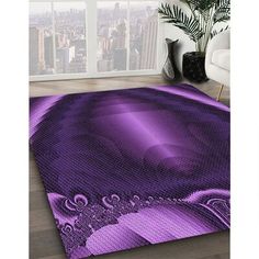 a purple rug with an intricate design on the floor in front of a large window