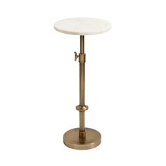 a white marble top and brass metal base table with an adjustable foot rest on it