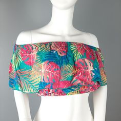 Ingear Resort Off The Shoulder Crop Top With All Around Ruffle In Blue Multi Palm Print One Size Fits Most - Shown On Size Small Mannequin All Measurements Are Approximate And Were Taken Across Item Lying Flat. Length 9.5" Across Top 13" (Elastic) Across Bottom 11.5" (Elastic) New With Tags Pink Tops For Vacation Beachwear, Pink Tops For Poolside Vacation, Blue Tropical Tops For Beach Party, Pink Beachwear Tops For Vacation, Pink Vacation Tops For Poolside, Blue Tropical Top For Beach Party, Tropical Blue Tops For Beach Party, Pink Hawaiian Top For Vacation, Tropical Pink Top For Beach Season