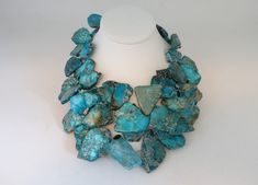 "This unique faux turquoise blue beaded necklaces is stunning. This is a truly unique piece with variations in stone colors and shapes. What a beautiful addition to your collection of traditional Southwest style jewelry and your wardrobe! This piece is in excellent vintage condition. This necklace measures approximately 18\" from end to end. Please visit our main page for announcements and important information. Don't forget to Favorite our shop so you can find us again as we are always adding n Unique Turquoise Chrysocolla Beaded Necklaces, Blue Turquoise Necklace With Natural Stones, Unique Blue Beaded Necklaces With Stones, Unique Blue Turquoise Gemstone Bead Necklace, Unique Blue Turquoise Necklace With Gemstone Beads, Blue Turquoise Necklace With Stones, Unique Blue Turquoise Necklace With Stones, Fancy Clothes, Blue Beaded Necklace