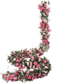 a sculpture made out of pink flowers on a white background with the letter l in it's center