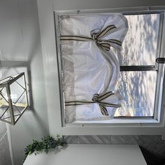 a white table sitting in front of a window