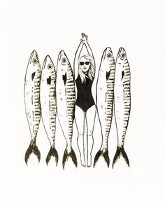 a woman in a bathing suit standing between five fish