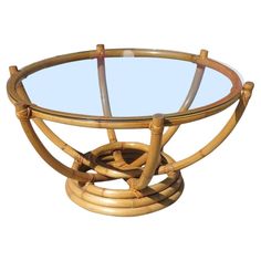 a round glass table with bamboo decoration