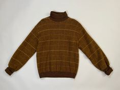 Vintage 1960's| 1970's striped turtle neck sweater by Pendleton. Great fall time mustardy colors of brown & yellow. Soft wool. Snug fit. In overall pretty good condition for its age. Please see all photos & measurements, item is being sold as-is. . M E A S U R E M E N T S.  measured laying flat  Shoulder to shoulder: 20 inches  Pit to pit: 20 inches   Waist: 16.5 inches  but can stretch to 21 inches Length: 26 inches Sleeve length:  uncuffed 24.5 inches  Material:  pure virgin wool Size:  labele 70s Wool Sweater, Vintage Mustard Sweater For Winter, Retro Brown Wool Sweater, Vintage Fitted Turtleneck Sweater, Vintage Turtleneck Tops For Fall, Vintage Mustard Sweater For Fall, Vintage Mustard Long Sleeve Sweater, Vintage Long Sleeve Mustard Sweater, Mustard Vintage Long Sleeve Sweater