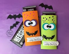 two halloween candy wrappers with eyes and bats on them