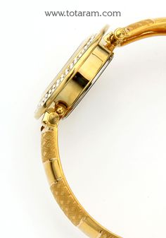 22 Karat Gold Watch - Titan Raga Watch - Womens Gold Watch With Cz 
  Diameter of the watch dial : 1.05 inches
  Please Note: The dial of the watch is NOT made of Gold, only the strap connecting (joining) the watch is made of Gold


Discover the allure of Indian craftsmanship with this exquisite 22 Karat Gold Watch from Titan Raga. Designed for women who appreciate the beauty of fine jewelry, this watch seamlessly blends traditional elegance with contemporary style. 
 
 Featuring a sleek and fem Gold Diamond Watch With Metal Round Dial, Gold Round Watch With Skeleton Dial, Gold Round Skeleton Dial Watch, Gold Diamond Analog Watch With Round Dial, Gold Analog Diamond Watch With Round Dial, Gold Analog Diamond Watch, Gold Jewelry And Watches With Metal Dial As Gifts, Gold Round Watch With Subdials, Gold Watches With Subdials For Gift