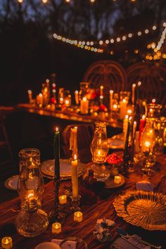 a table with candles and plates on it