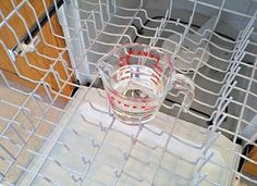 a glass pitcher sitting on top of a table