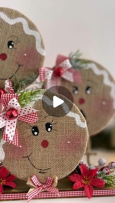 two gingerbread man and woman ornaments with poinsettis