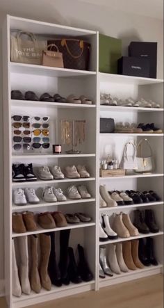 a large white shelf filled with lots of shoes