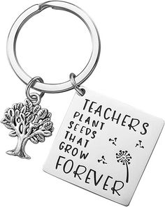 a keychain with a tree and teacher's seeds that grow forever on it