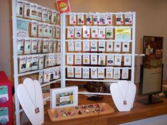 there are many items on display in the store, including cards and magnets for children's crafts