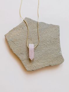 A striking crystal strung through our slim heavily plated 18kt gold chain, creating a daily space for self-care and wellness no matter what is on your plate. Rose Quartz amplifies the essence of love and opens the heart on all levels. Use to nurture friendships, deep inner healing and feelings of peace. A statement piece to wear alone, or layer up two or three for a unique and mindful look!Genuine Rose Quartz crystal pointPoint Approximately 35mm length, 15mm widthAs with natural stones, each wi Comfort Gifts, Rose Quartz Pendant, Inner Healing, Chain Extenders, Rose Quartz Crystal, Quartz Points, Quartz Pendant, Gold Chain Necklace, Heart On