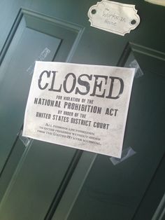 a closed sign posted on the front door of a building in washington, d c