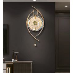 a clock that is on the side of a wall next to a cabinet in a room