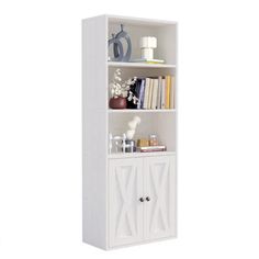 a white bookcase with two doors and shelves