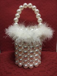 White Handheld Evening Bag For Party, Formal Beaded Pearl Evening Bag, Pearl Beaded Evening Bag For Formal Occasions, Glamorous White Formal Bags, Glamorous Pearl Clutch With Pearl Handle, Glamorous White Bags For Formal Occasions, Glamorous Bucket Evening Bag, White Evening Bag With Pearl Handle For Party, Glamorous Handheld Evening Bag With Pearl Handle