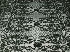 black and white lace fabric with floral design on the bottom, as seen from above