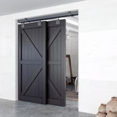 an open black door in a white room