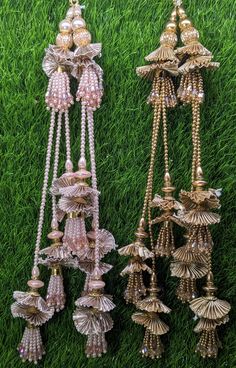 Indian Handmade Beaded Lahenga Latkan Tassels for Saree HandBags Hangings Dupatta Bridal Wedding dress for Women pair of 2 pcs Size - 32 cm Length  Item Description You can use this Beautiful pair of tassle for several DIY projects.  *These beautiful Tassel Latkans are used as the accessory for Lahenga and saree , but u can use according to your need and your innovative ideas. * Package contains 2 Latkan / 1 Pair you can use these latkans in various ways Craft Projects Designing Home Decoration Festive celebrations. Evening and party Apparels. Home décor items Apparel & Fashion Scarves n Stoles Headband, hats Table cover, curtains, Pillow covers, Cushion cover Shoe designing Headband, hats Table cover, curtains Designing stylish blouses Ship From New Delhi, India 2 Latkan / 1 Pair Luxury Bollywood Jewelry With Latkans, Luxury Saree With Latkans, Luxury Traditional Danglers With Latkans, Luxury Festive Chandelier Earrings With Latkans, Latkan Tassels Blouses Weddings, Luxury Chandbalis With Latkans As A Gift, Luxury Latkans Necklace For Wedding, Affordable Wedding Chandbalis With Latkans, Cheap Chandbalis With Latkans For Wedding